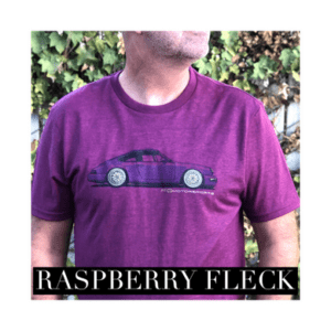 A man wearing a purple shirt with a car on it.